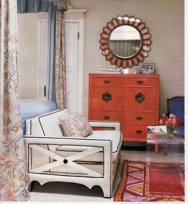 lucite table in a sitting area in a bedroom