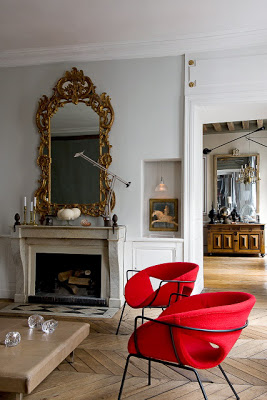Parisian apartment, fireplace and red chairs