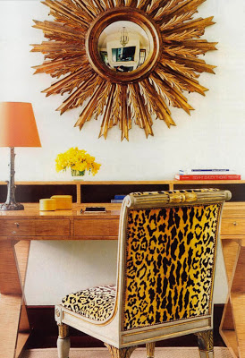 rustic chic design with sunburst mirror and leopard chair