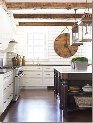 white kitchen with floor to ceiling tiles on the walls via belle vivir