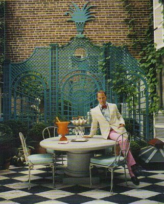 New York city backyards MIles Redd sitting on a table in his nyc backyard with black ahd white floor via belle vivir blog