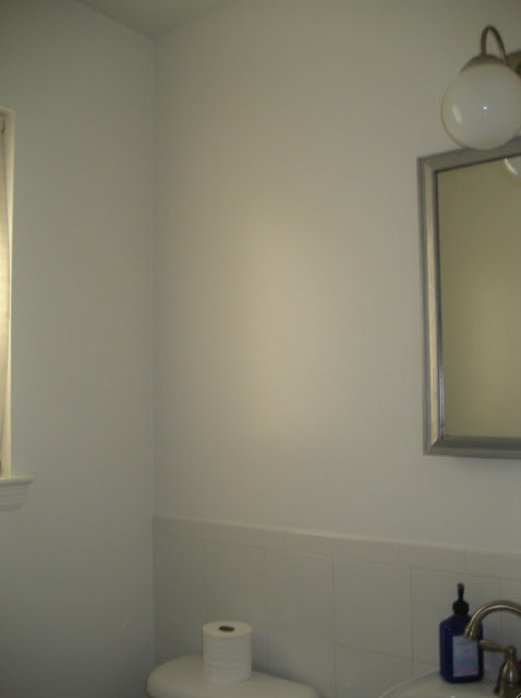 how to transform a powder room with wallpaper remnants via belle vivir interior design blog