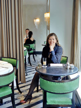 Ilse Crawford sitting at one of her commercial space design via belle vivir blog