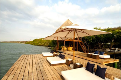 Hotel AGua Baru Island swimming pool umbrella via belle vivir blog