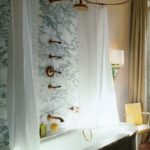 White bathrooms with brass fixture