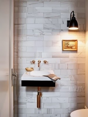 White marble Bathroom with Brass Fixture, marble walls with brass fixtures
