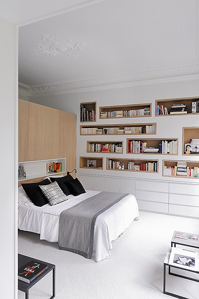 bedroom with recessed shelves