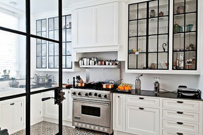 white kitchen with steel and glass cabinet doors via belle vivir blog