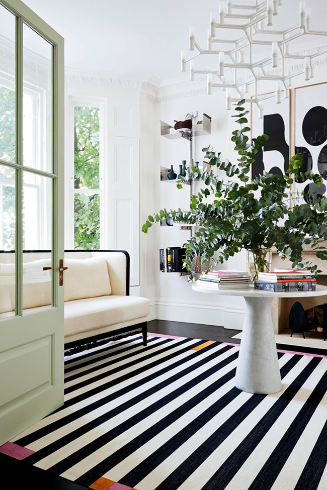 black and white floors, black and white striped rug in entryway