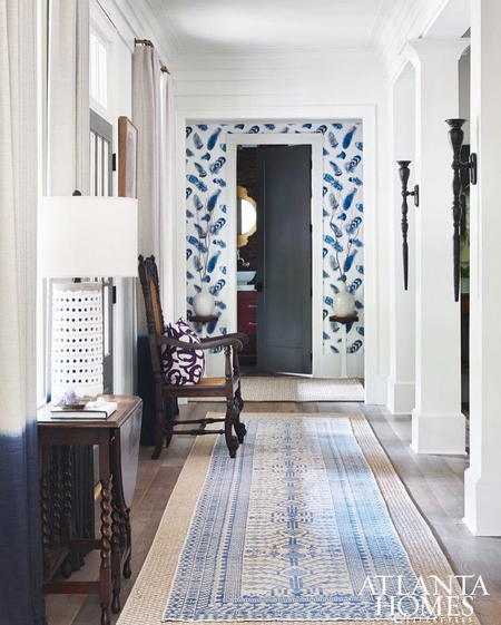 hallway with layered rugs traditional rug over jute rug