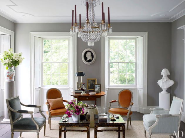 sophisticated color palette, grey walls, ecru chairs, and white chair