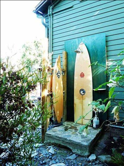 outdoor shower with surfboards