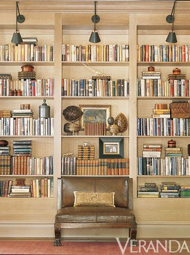 bookshelves with sconces for lighting