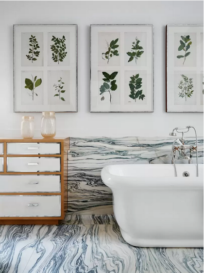 bathroom design with tub and botanical prints