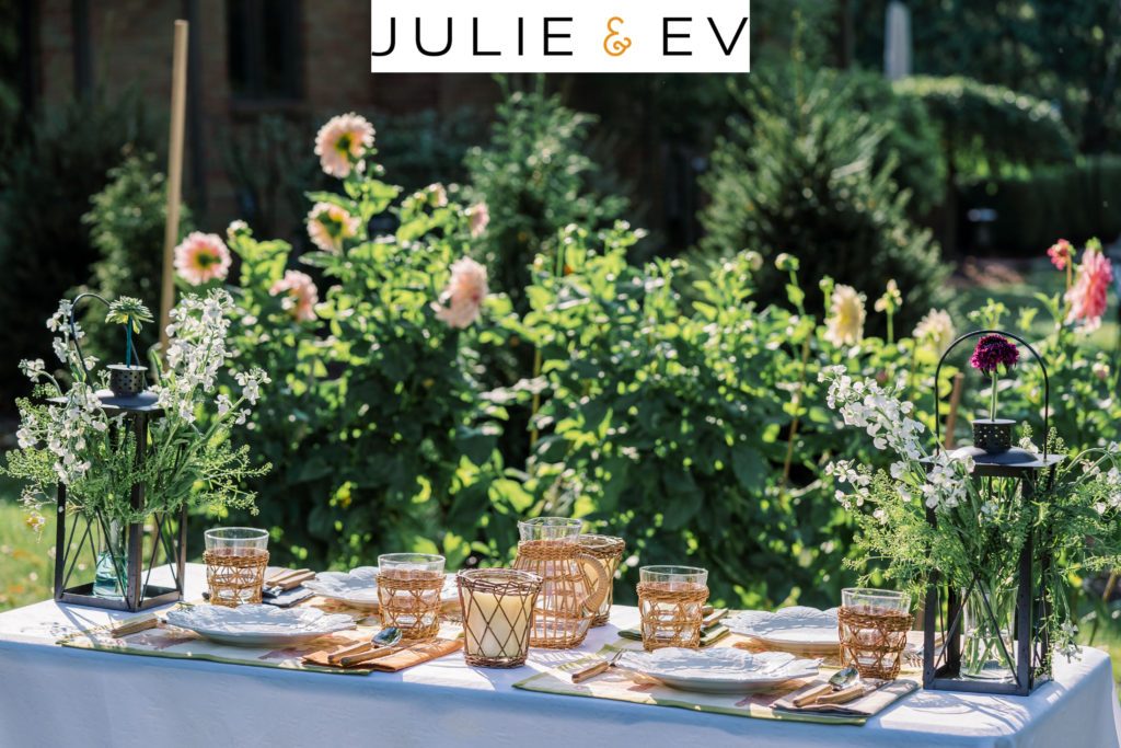 Julie and Ev outdoor table setting with rattan wrapped tumbler